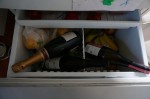 Wine bottles in fridge vegetable bin