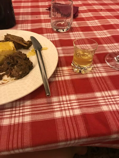 after-dinner-entertainment-venison-beef-polenta-glass-limoncello-four-winds-follina-italy