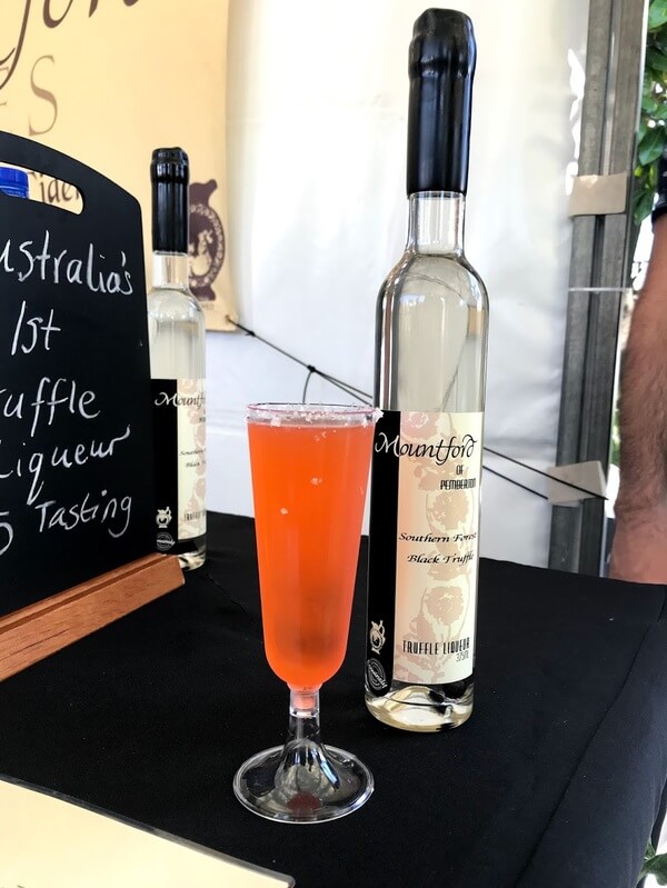 glass-and-bottle-of-truffle-liqueur-cocktail-with-aperol-and-gin
