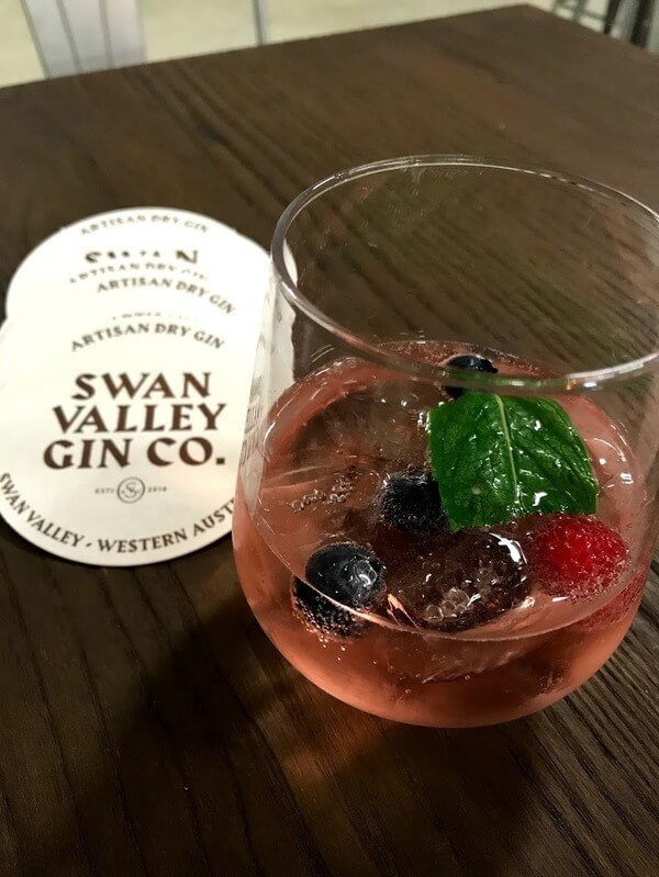glass-of-sparkling-muscato-and-strawberry-artisan-gin-at-pandemonium-estate