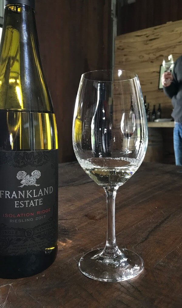 bottle-and-glass-of-frankland-estate-isolation-ridge-riesling-in-frankland-river-great-southern