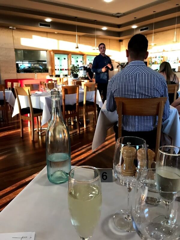 daniel-pinelli-talking-to-the-crowd-before-dinner-at-pinelli-estate-winery-restaurant