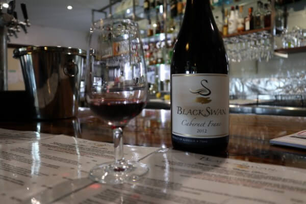 glass-and-bottle-of-cabernet-franc-at-black-swan-winery-swan-valley