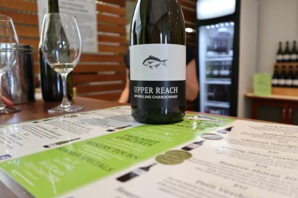 glass-and-bottle-of-sparkling-chardonnay-at-upper-reach-winery-swan-valley