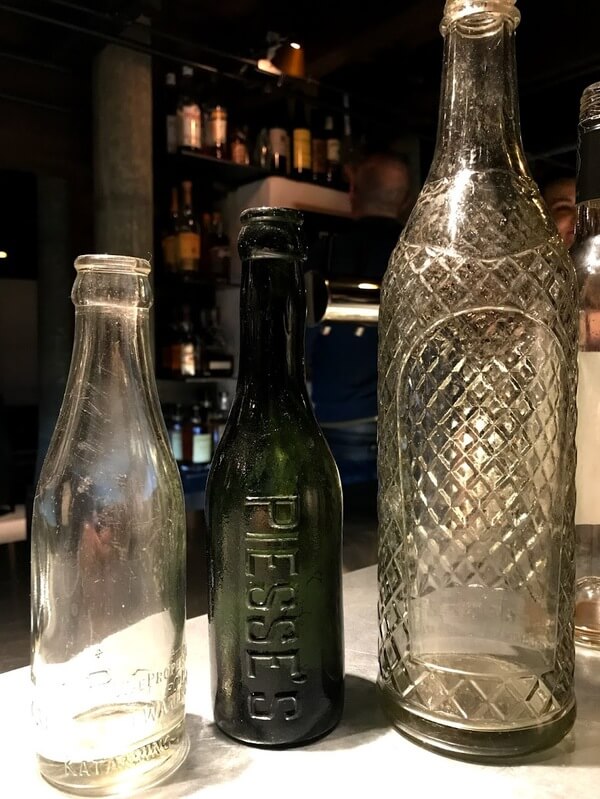 three-piesse-cordial-bottles-in-clear-and-green-in-the-cordial-bar-at-the-premier-mill-hotel-katanning