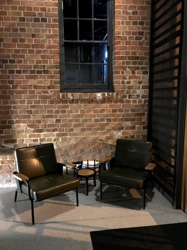 two-brown-leather-sitting-chairs-inside-the-front-foyer-at-the-premier-mill-hotel-katanning