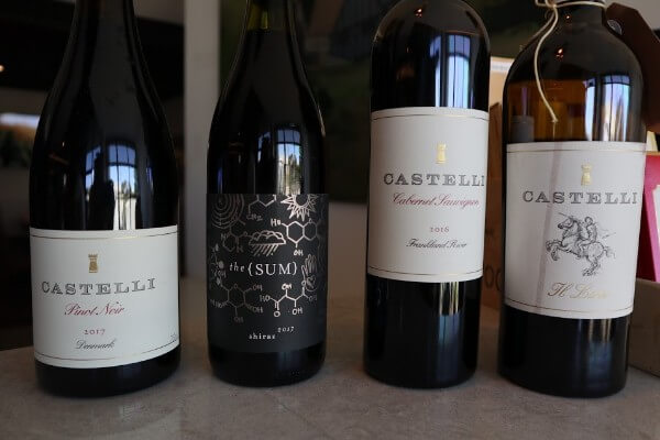 four bottles of castelli wine pinot noir the sum shiraz castelli cabernet sauvignon and il liria