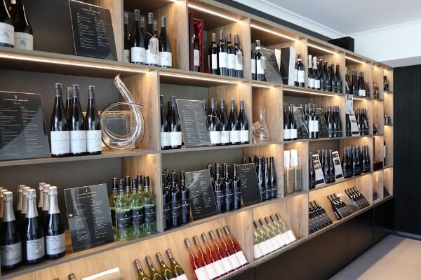 shelves with castelli wine and decanters for sale