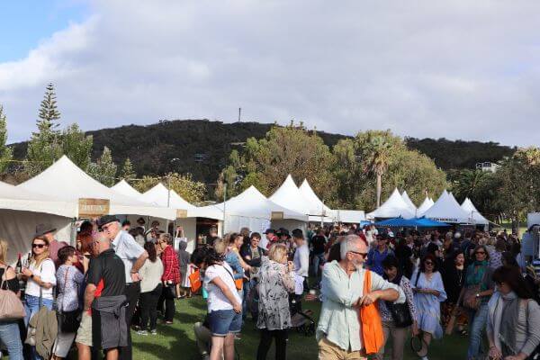 the crowd at the albany wine and food festival with mount clarance in the background