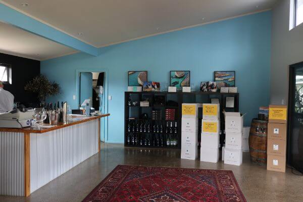 cellar door serving area with blue walls and a tin bar at estate 807 on scotsdale road denmark wine region