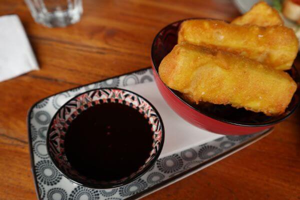 crispy tofu chickpea and tumeriic batter chilli gnger dipping sauce at garrisons in albany