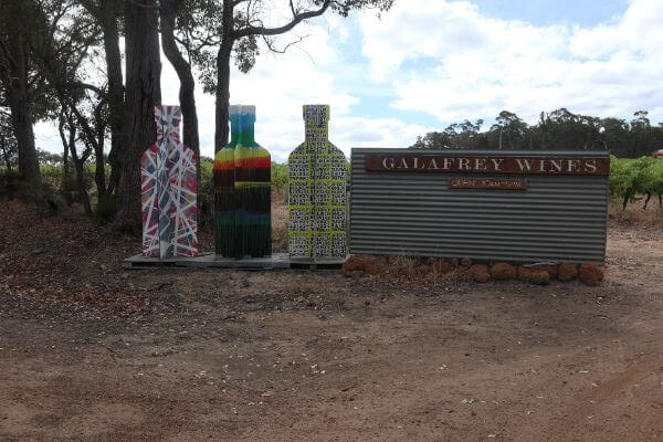 entry into galafrey winery woith three cutout colourful wine bottles