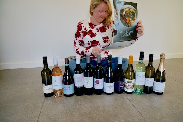 Casey opening her Wine Selectors 2020 wine and food calendar case
